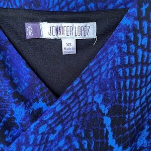 Jennifer Lopez blue snake print dress.